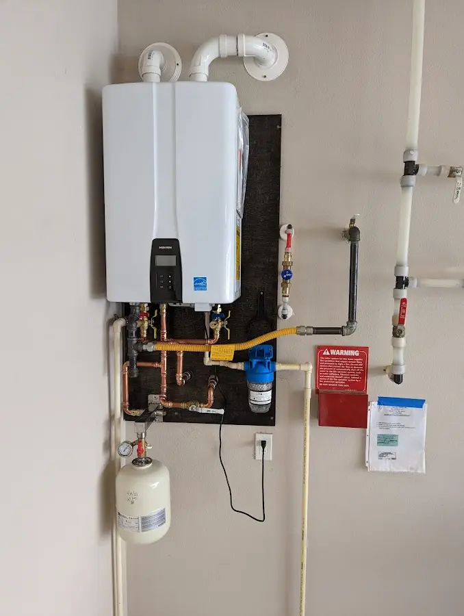 Professional plumber installing copper piping in a Fort Leonard Wood home